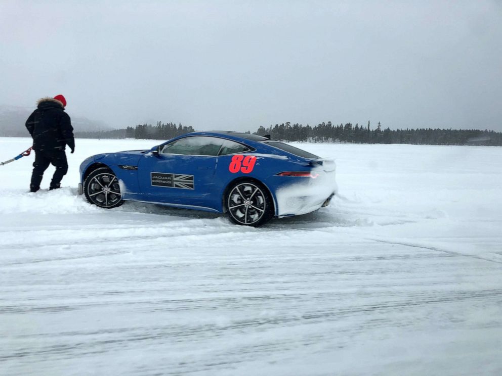 PHOTO: A rear-wheel drive Jaguar F-TYPE stuck in a snowbank.