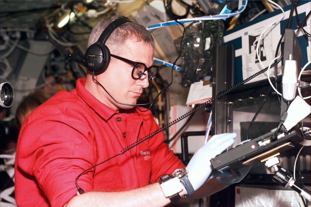 PHOTO: STS-90 payload specialist Jay Buckey is photographed at the General Purpose Work Station  working at the rodent motor skills experiment in the Spacelab module on flight day 4 of the Neurolab mission in 1998.