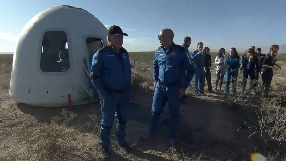 PHOTO: A screenshot taken from a live handout video on Oct. 13, 2021, shows Jeff Bezos talking to William Shatner after Blue Origin's New Shepard crew capsule landed back in Texas.