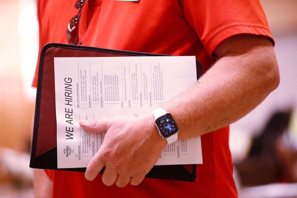 PHOTO: Florida residents attend a job fair seeking employment at the Seminole Hard Rock Casino on May 25, 2021, in Tampa, Fla.