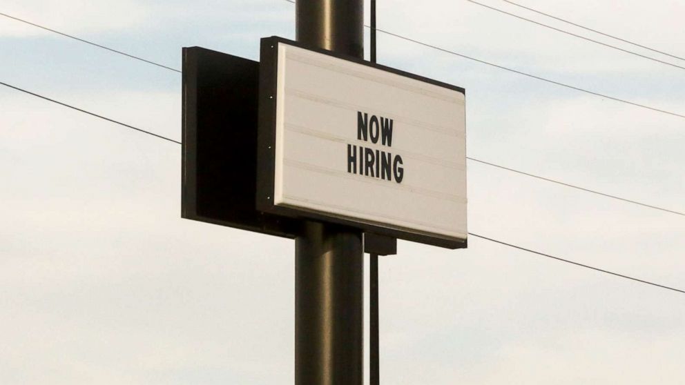 PHOTO: A "Now Hiring" sign faces Interstate I-44 in Tulsa, Okla., Oct. 26, 2021.