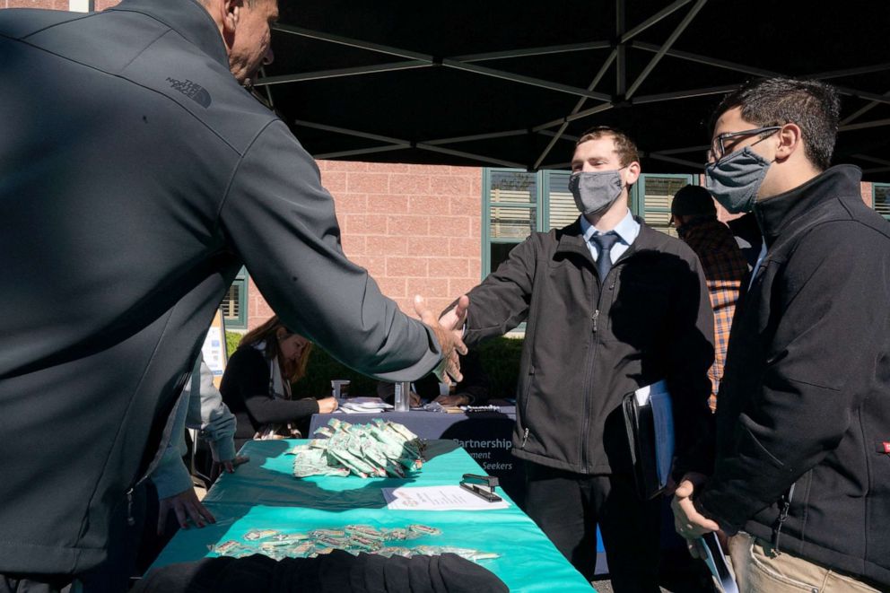 PHOTO: Glenn Marchese of Arizona Iced Tea shakes hands with Nathaniel Pagendarm at the Employers Only Long Island Food, Beverage and Hospitality Job Fair in Melville, N.Y.,  Oct. 19, 2021.