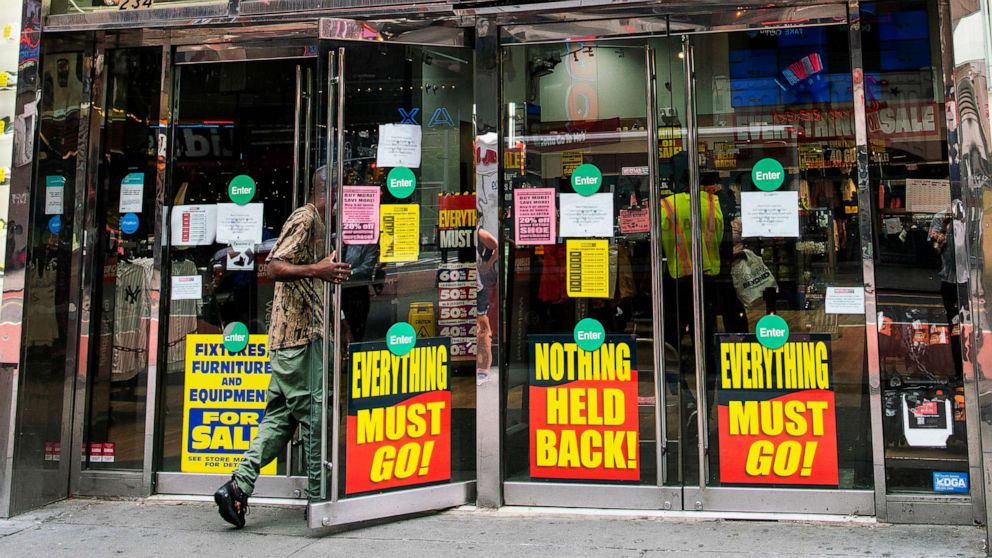PHOTO: A man enters a retail store closing in Times Square New York, Aug. 8, 2020.