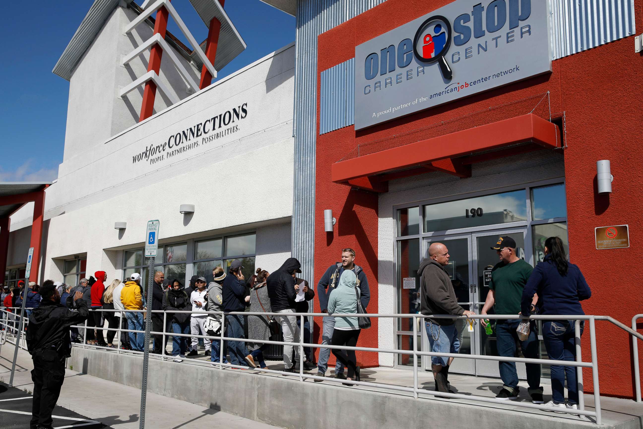 PHOTO: People wait in line for help with unemployment benefits at the One-Stop Career Center in Las Vegas, March 17, 2020.