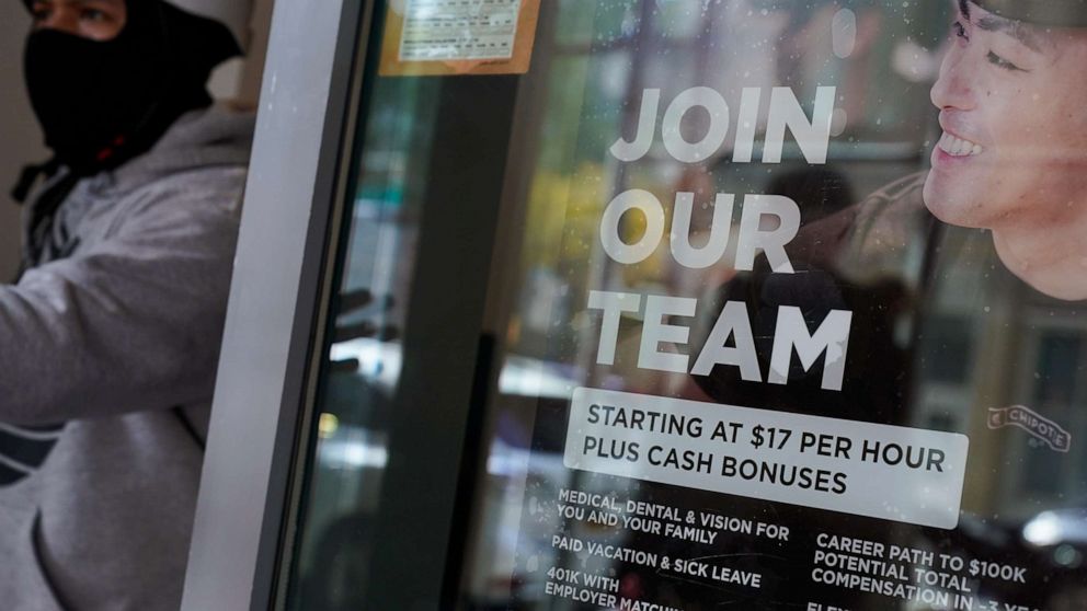 PHOTO: A hiring sign hangs in the window of a Chipotle in New York, Tuesday, Nov. 1, 2022. 