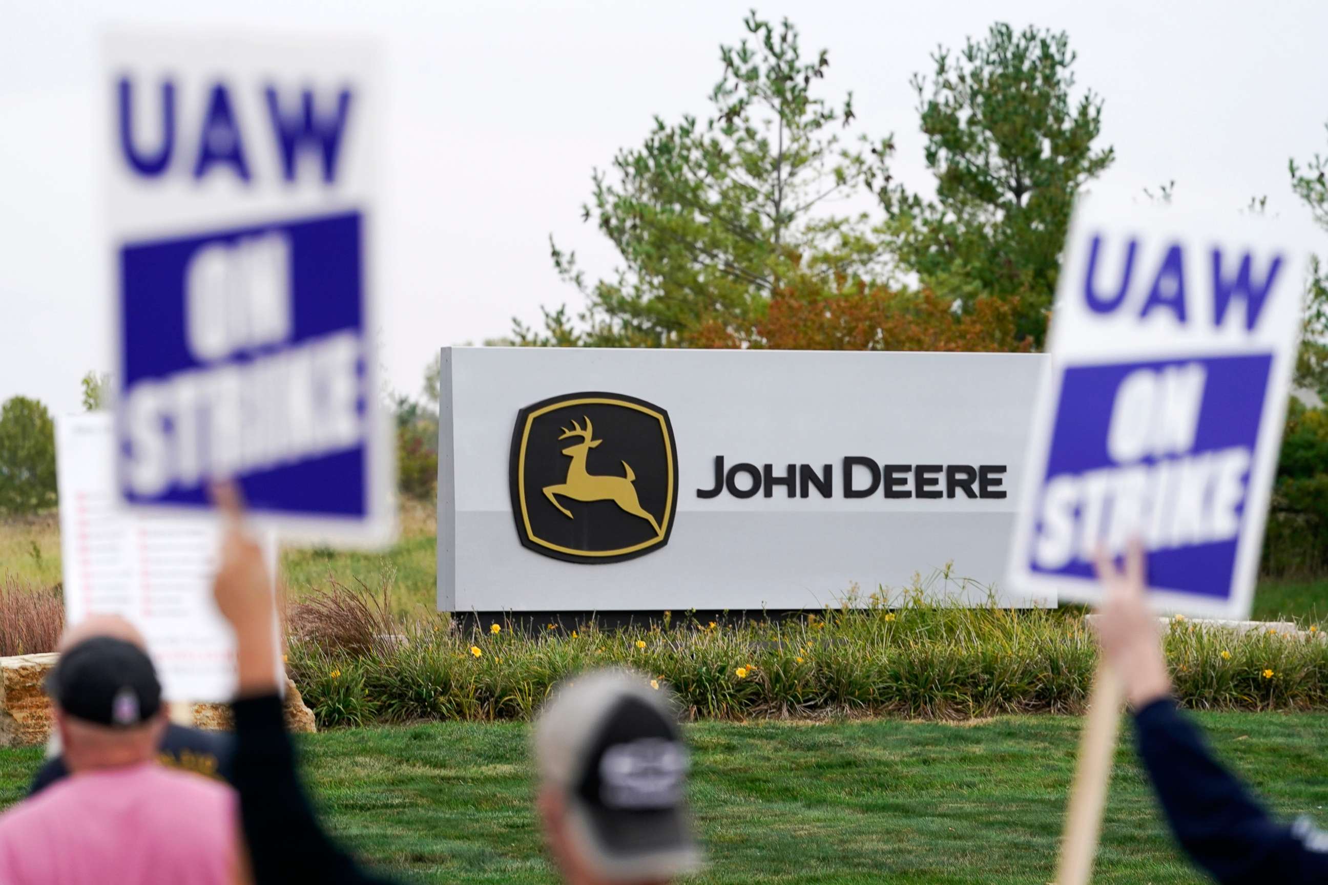 PHOTO: Members of the United Auto Workers strike outside of a John Deere plant on Oct. 20, 2021, in Ankeny, Iowa.
