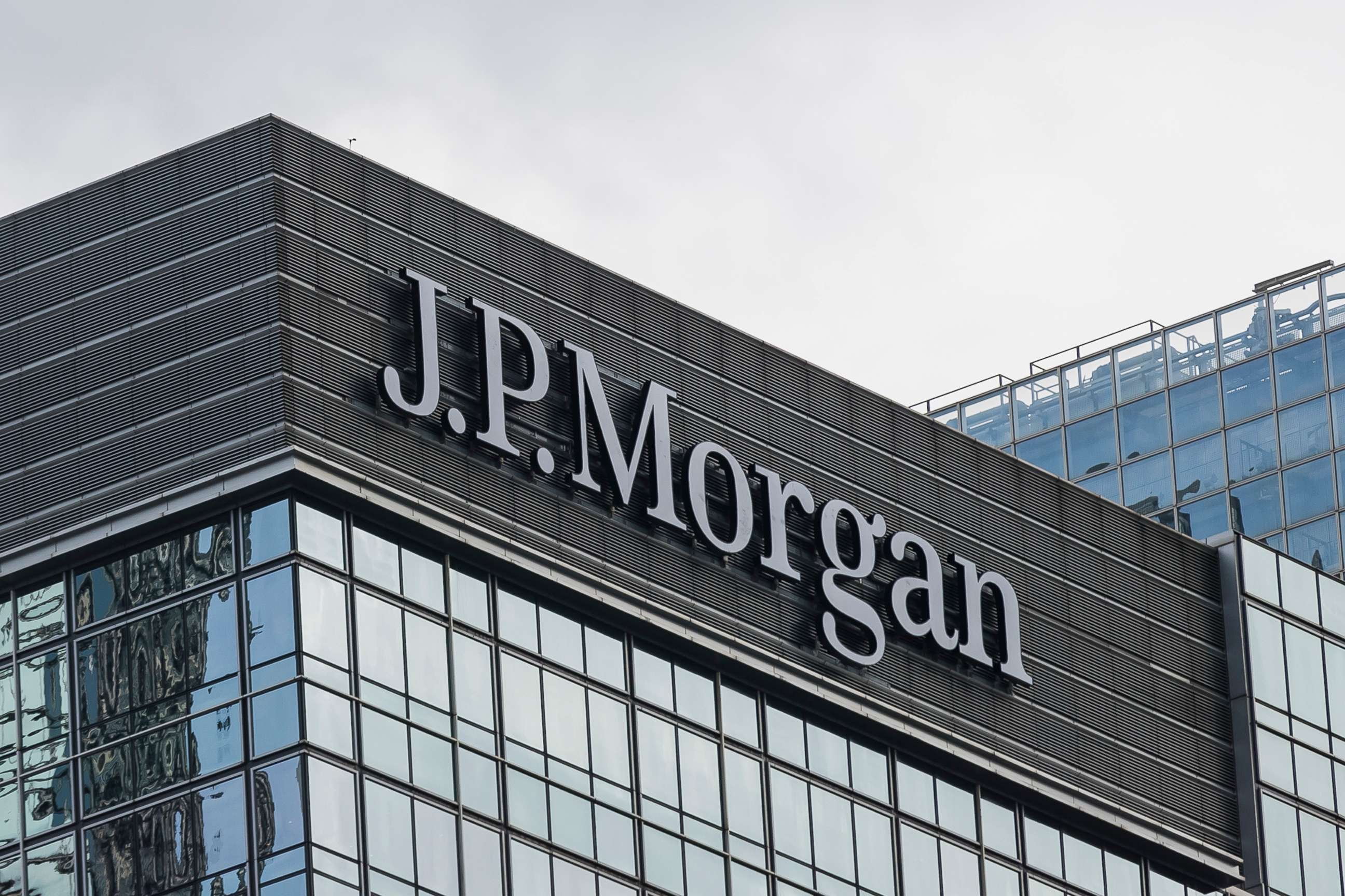 PHOTO: A J.P. Morgan logo is displayed atop at the Chater House on July 16, 2018 in Hong Kong.