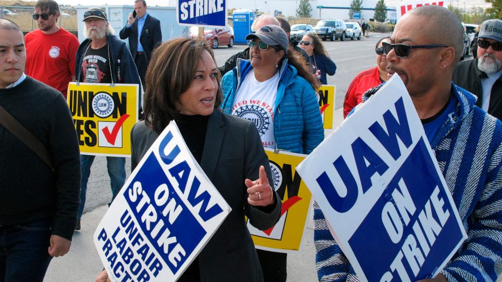 PHOTO: Vice President Kamala Harris talks to a union leader while she walks a picket line with striking UAW members, Oct. 3, 2019 at a General Motors facility just north of Reno, Nev.