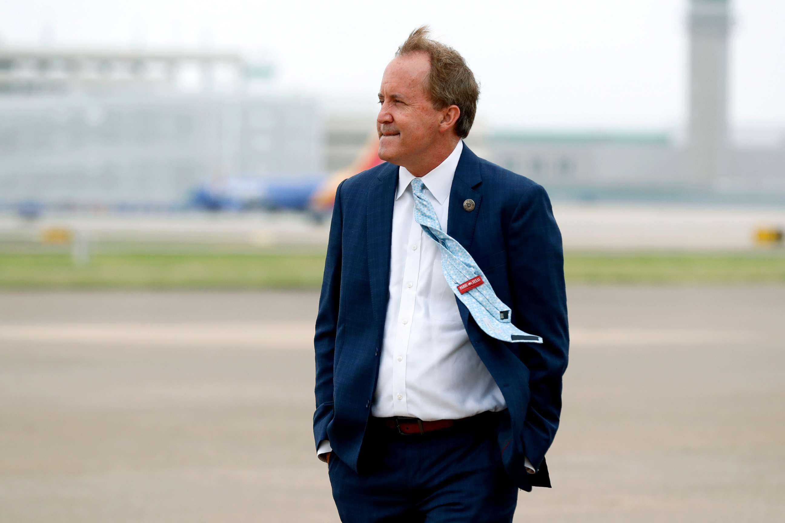 PHOTO: Texas' Attorney General Ken Paxton waits on the flight line for the arrival of Vice President Mike Pence at Love Field in Dallas, June 28, 2020.