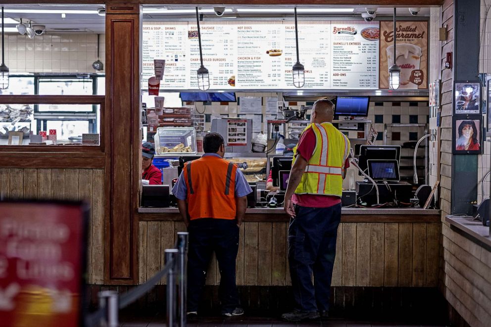 PHOTO: FILE - Customers order food at a Portillo's restaurant in Chicago, Sept. 27, 2022.