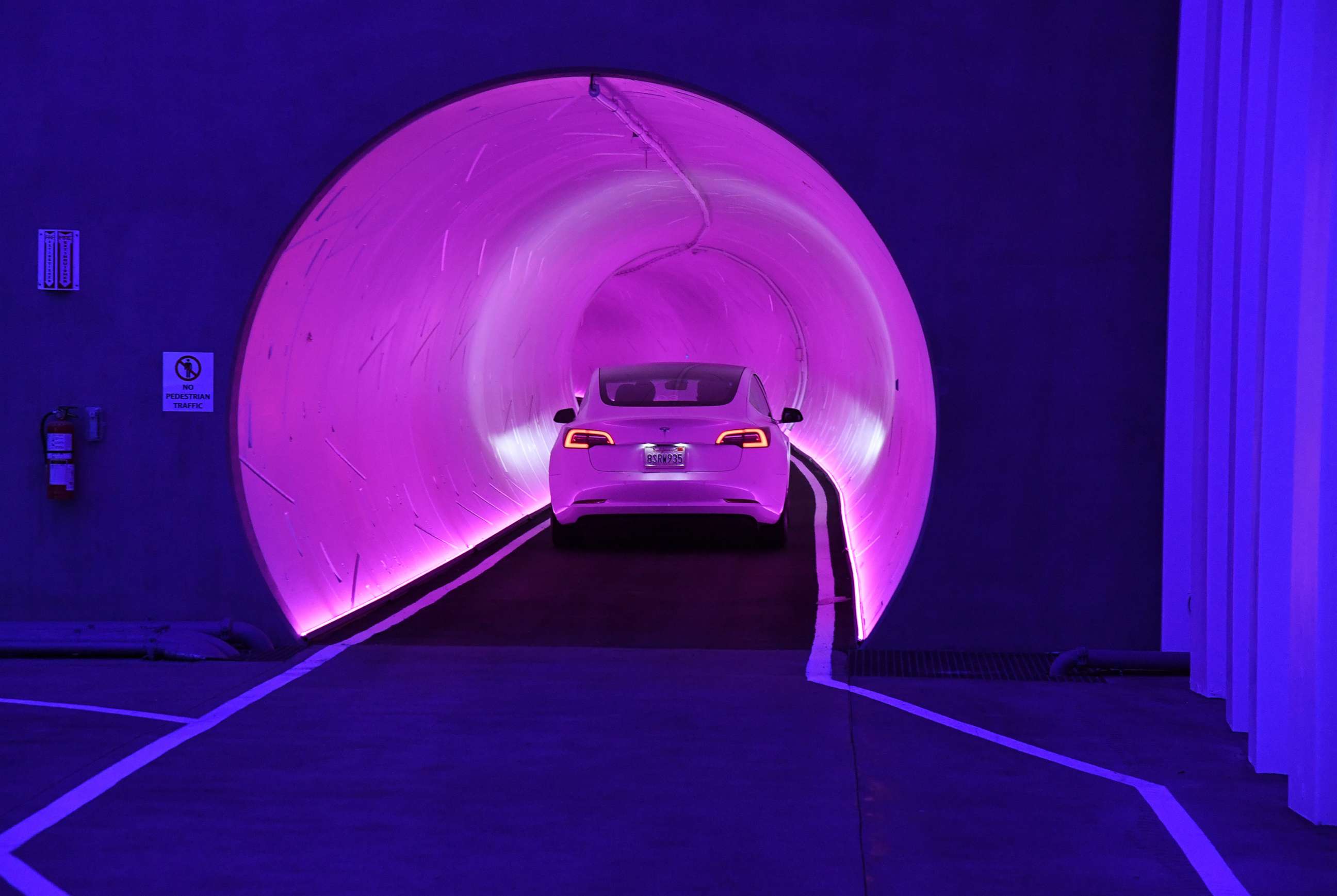 PHOTO: A Tesla car drives through a tunnel during a media preview of the Las Vegas Convention Center Loop, April 9, 2021, in Las Vegas, Nevada. 