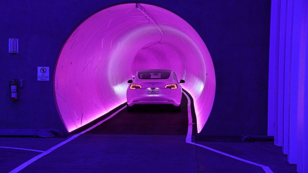 PHOTO: A Tesla car drives through a tunnel during a media preview of the Las Vegas Convention Center Loop, April 9, 2021, in Las Vegas, Nevada. 