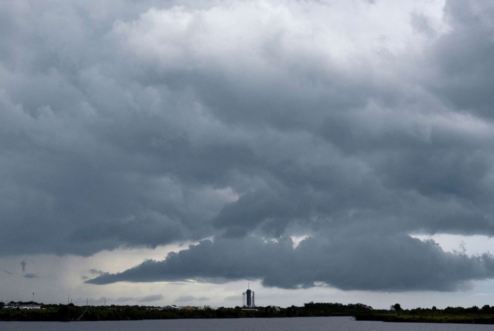 PHOTO: A SpaceX Falcon 9 rocket with Crew Dragon spacecraft is seen under clouds during NASA's SpaceX Demo-2 mission to the International Space Station from NASA's Kennedy Space Center in Cape Canaveral, Fla., May 27, 2020