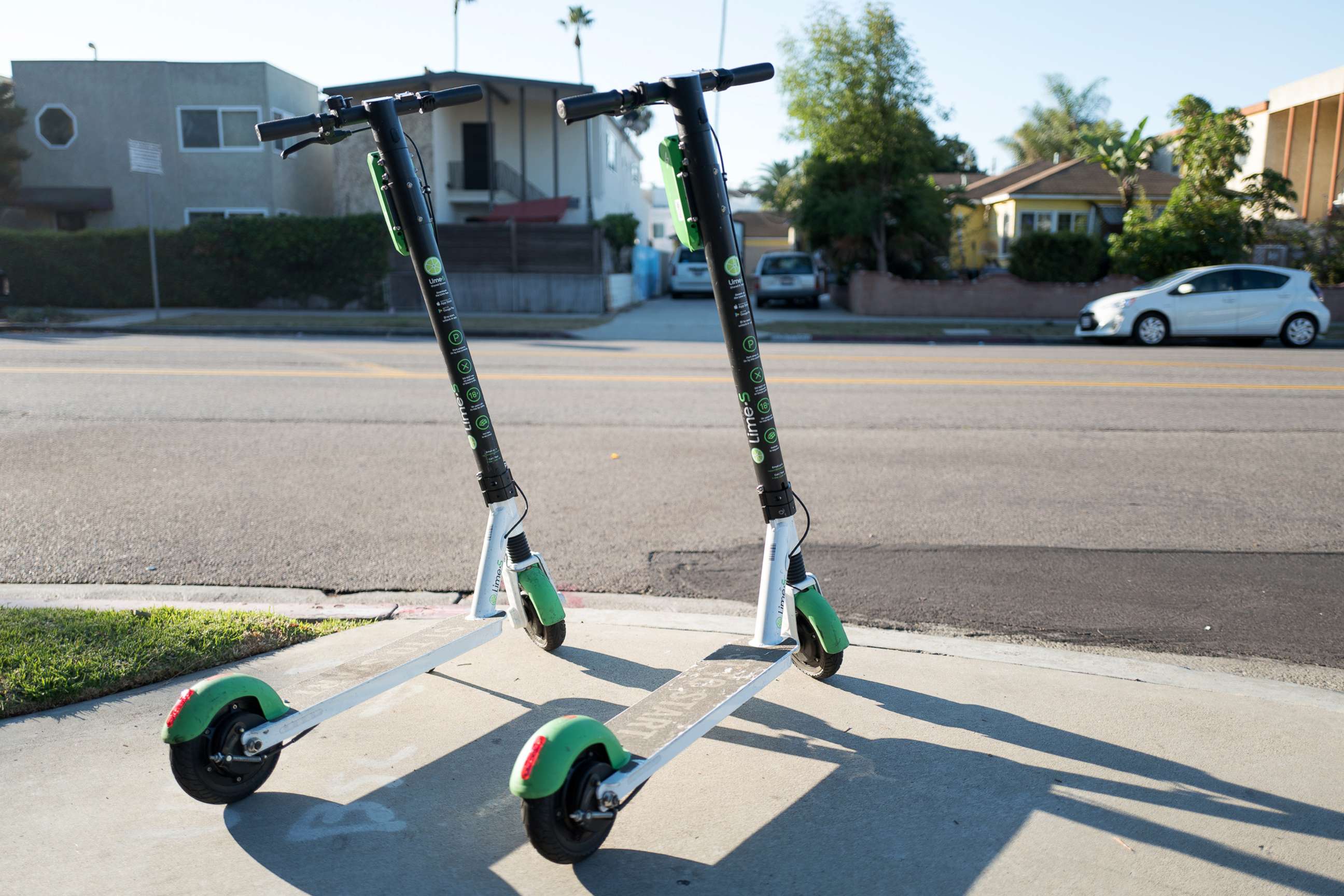 PHOTO: Two scooters from dockless electric scooter sharing economy company Lime are parked in a "hub" near a road in Marina Del Rey, Los Angeles, Oct. 21, 2018.