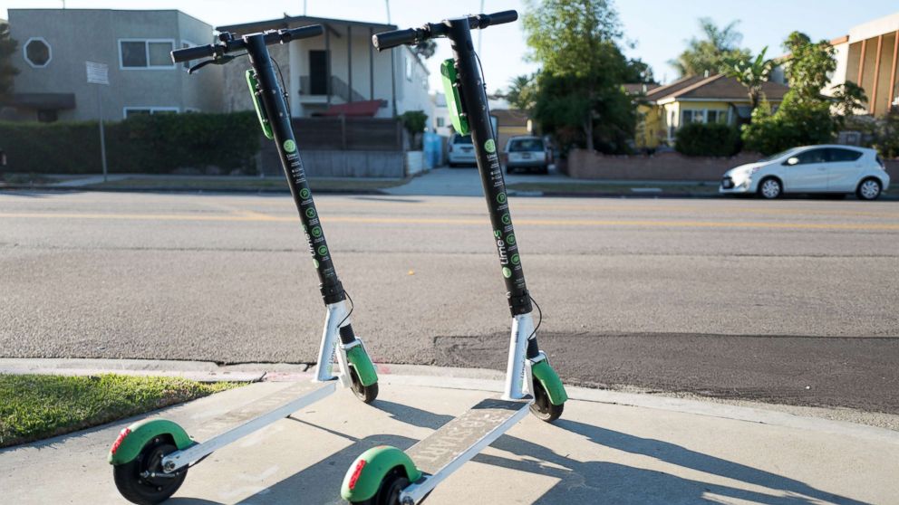 PHOTO: Two scooters from dockless electric scooter sharing economy company Lime are parked in a "hub" near a road in Marina Del Rey, Los Angeles, Oct. 21, 2018.