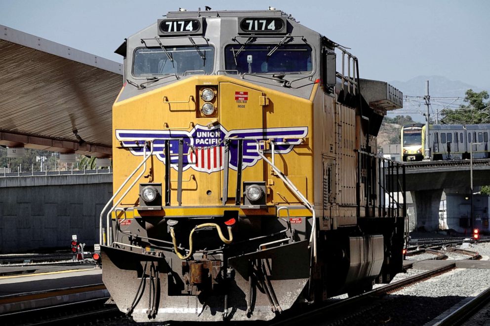 PHOTO: PHOTO: A GE AC4400CW diesel-electric locomotive in Union Pacific livery, is seen ahead of a possible strike if there is no deal with the rail worker unions, as a Metrolink commuter train arrives at Union Station in Los Angeles, Sept. 15, 2022.
