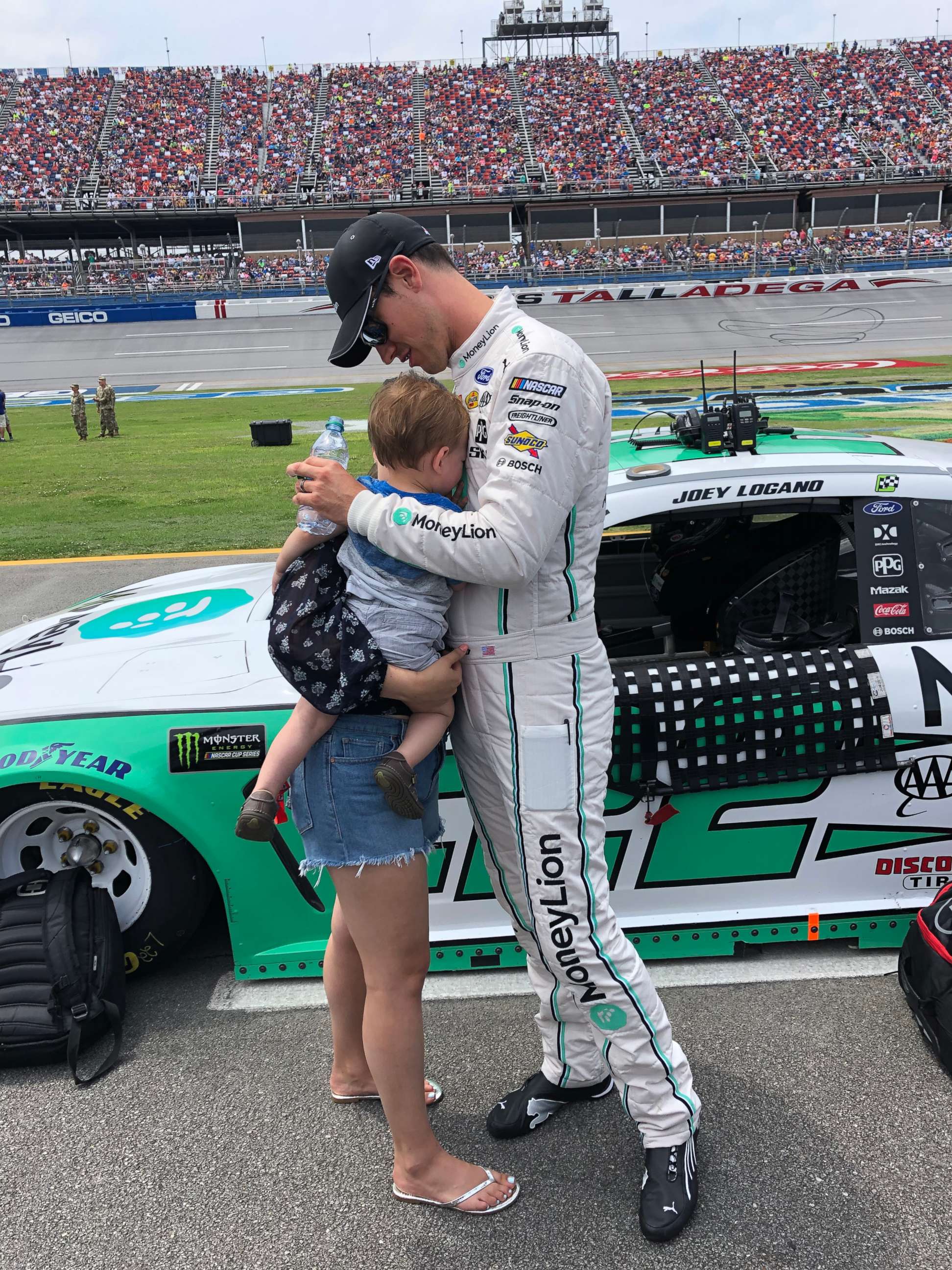 PHOTO: Joey Logano and his family share a sweet moment before a NASCAR race at Talladega Superspeedway, April 28, 2019. 