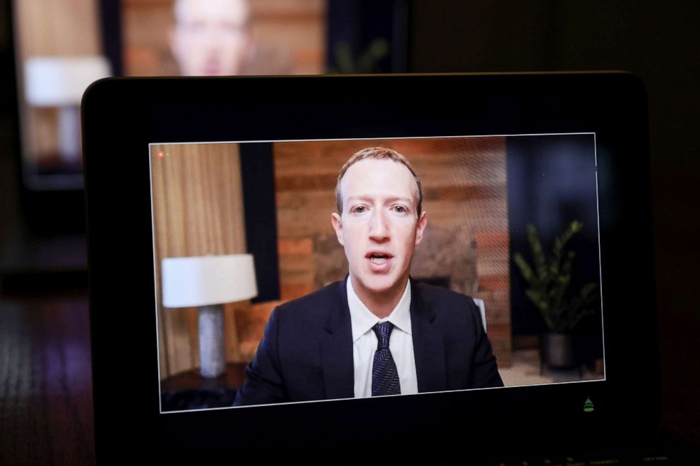 PHOTO: Mark Zuckerberg, CEO of Facebook Inc., is seen on a laptop computer as he speaks virtually from Tiskilwa, Ill., during a House Energy and Commerce Subcommittees hearing on March 25, 2021.