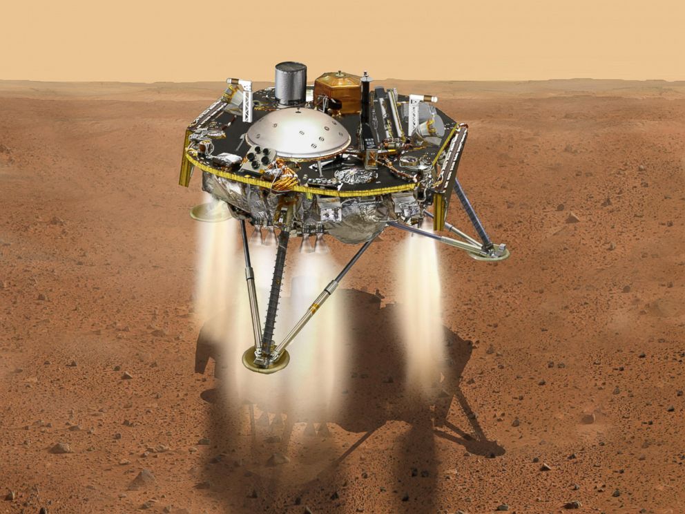 PHOTO: This NASA illustration shows a simulated view of NASAs InSight lander firing retrorockets to slow down as it descends toward the surface of Mars.