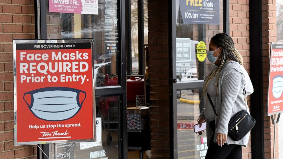 PHOTO: A mask mandate remains in effect as shoppers enter a store in Plano, Texas, March 9, 2021. 