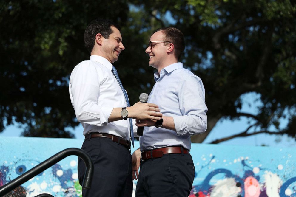 PHOTO: Democratic presidential candidate Pete Buttigieg is introduced by his husband, Chasten Glezman Buttigieg, during a grassroots fundraiser on May 20, 2019, in Miami. 