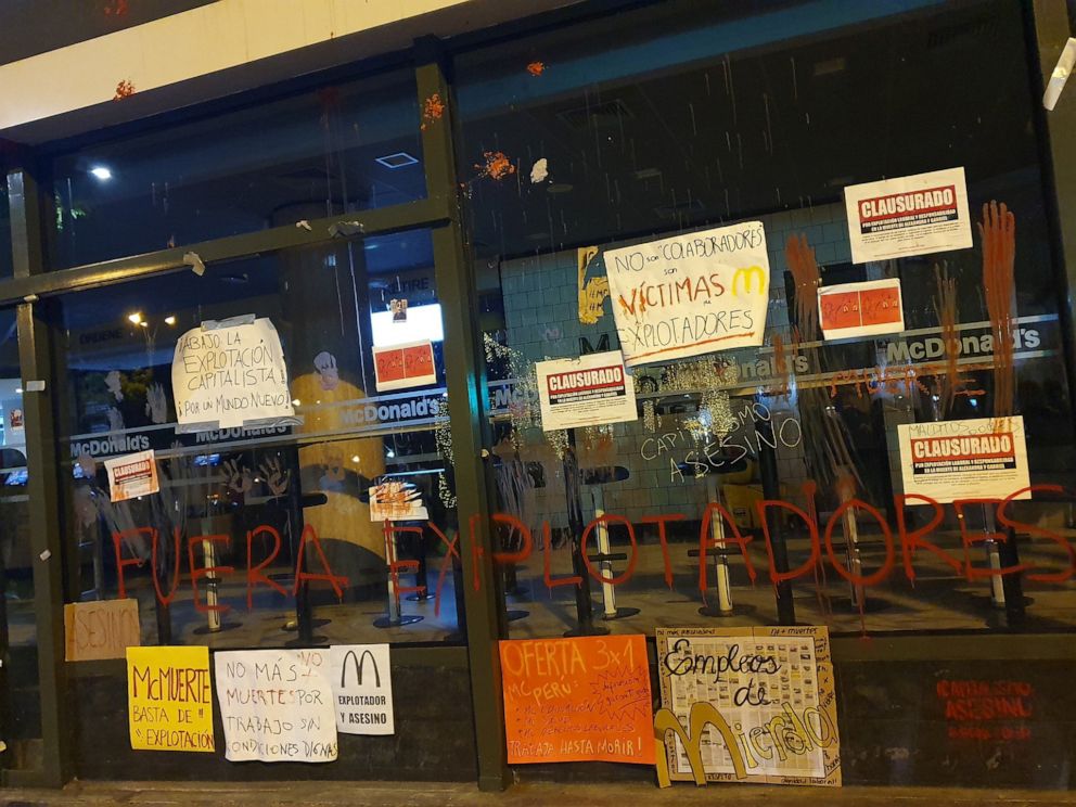 PHOTO: Protest signs are seen outside of a closed McDonald's restaurant, in Miraflores near Lima, Peru, Dec. 17, 2019.