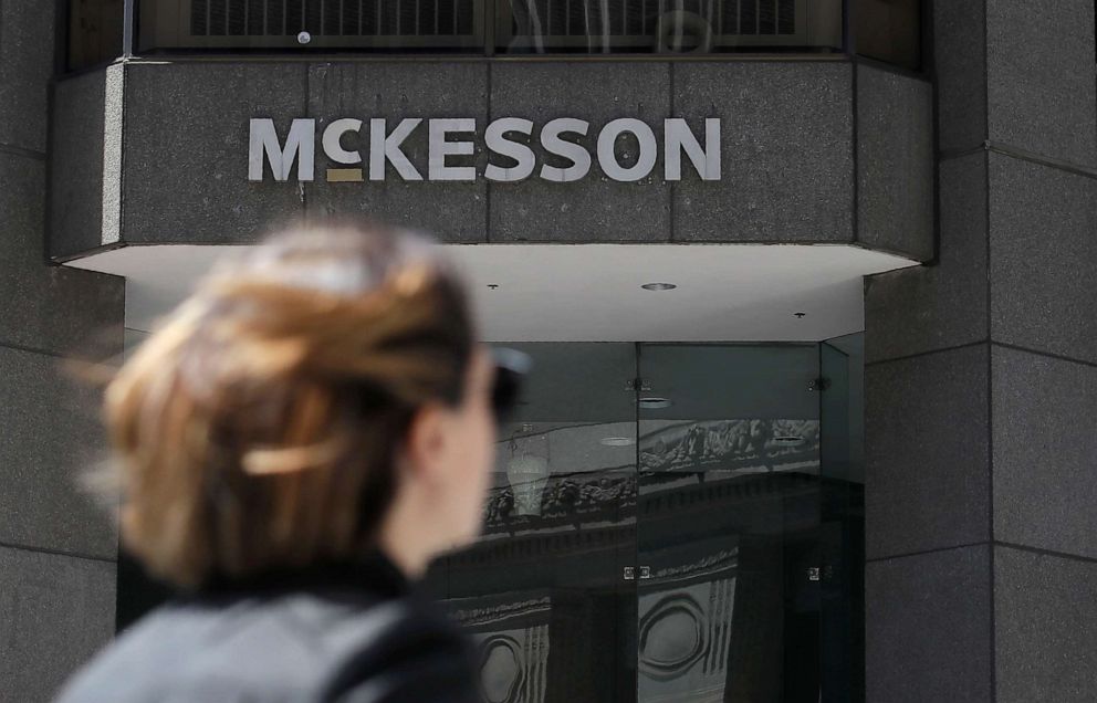 PHOTO: A pedestrian passes a McKesson sign on an office building in San Francisco.