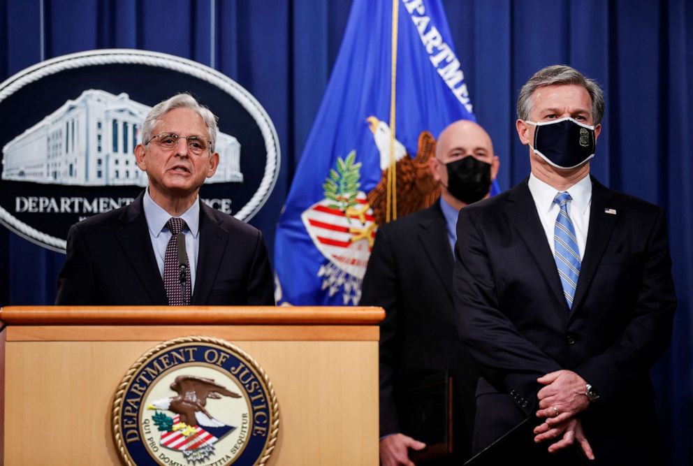 PHOTO: U.S. Attorney General Merrick Garland, flanked by FBI Director Christopher Wray, announces charges against a suspect from Ukraine and a Russian national over a July ransomware attack, during a news conference in Washington, D.C., Nov. 8, 2021.