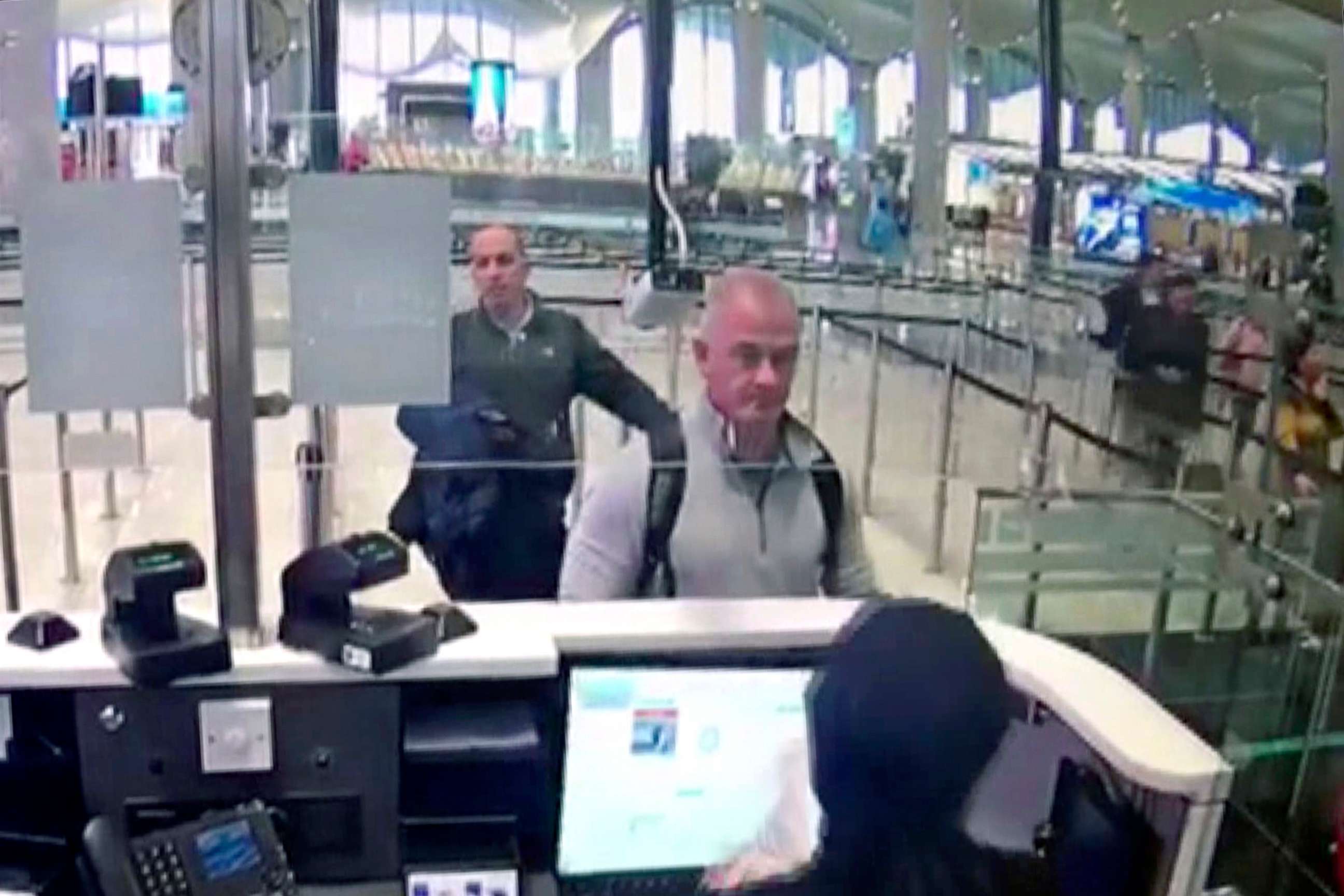 PHOTO: This Dec. 30, 2019, image from security camera video shows Michael L. Taylor, center, and George-Antoine Zayek at passport control at Istanbul Airport in Turkey.