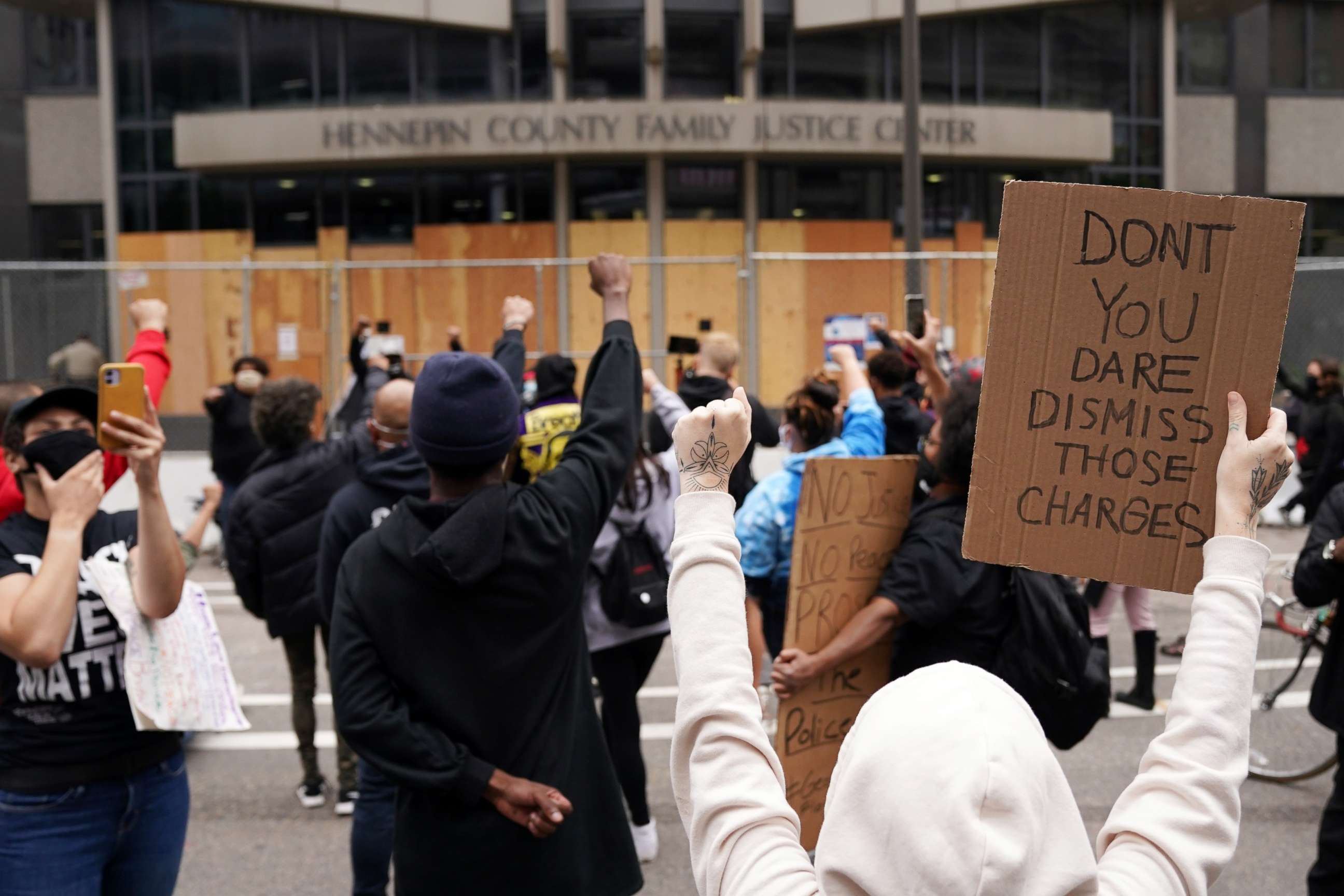 PHOTO: Protesters chant outside the Hennepin County Family Justice Center following a hearing in the cases against four former officers in the killing of George Floyd, in Minneapolis, Sept. 11, 2020.