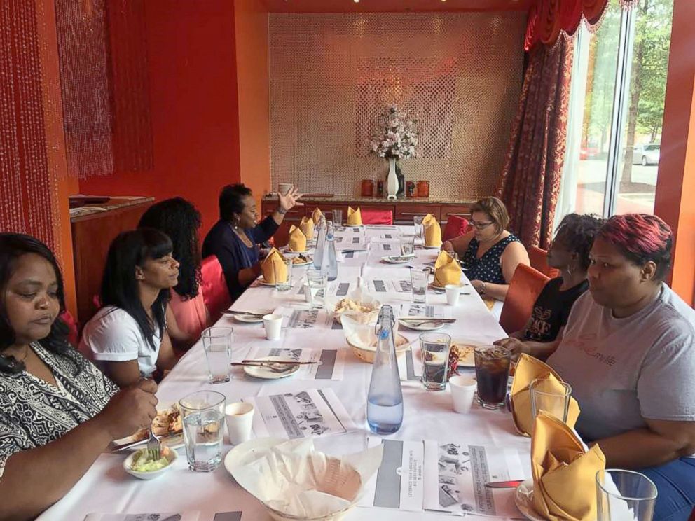 PHOTO: Girls Just Wanna Have Funds members discuss finances at a meeting in Washington, D.C.