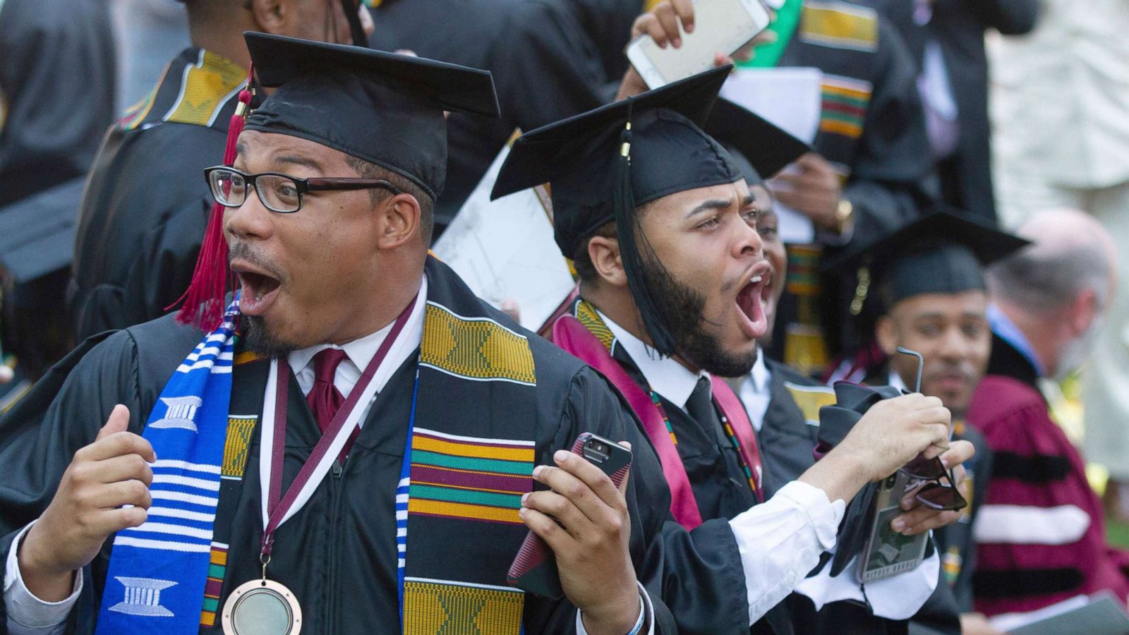 PHOTO: Graduates react after hearing billionaire technology investor and philanthropist Robert F. Smith say he will provide grants to wipe out the student debt of the entire 2019 graduating class at Morehouse College in Atlanta, May 19, 2019.