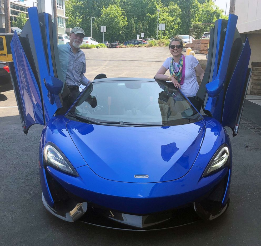 PHOTO: Morgan Korn and her dad Buz Korn posing with a McLaren 570S Spider, May 23, 2018. 