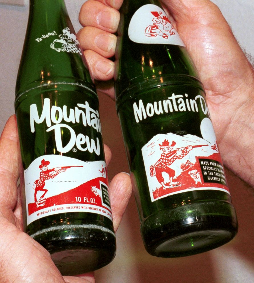 PHOTO: A Mountain Dew bottle from the middle 1960's, left, and a bottl...