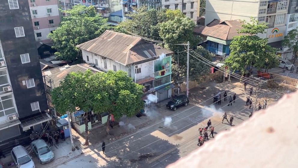 PHOTO: Police officers fire their weapons during a protest in Yangon, Myanmar, March 4, 2021, in this still image taken from a video obtained by Reuters.