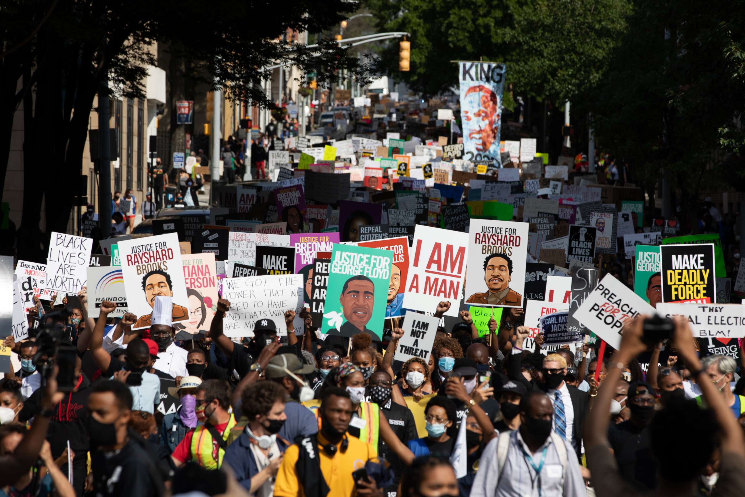 PHOTO: Protesters take part in the "March on Georgia," organized by the National Association for the Advancement of Colored People (NAACP), in downtown Atlanta, Georgia, on June 15, 2020. 