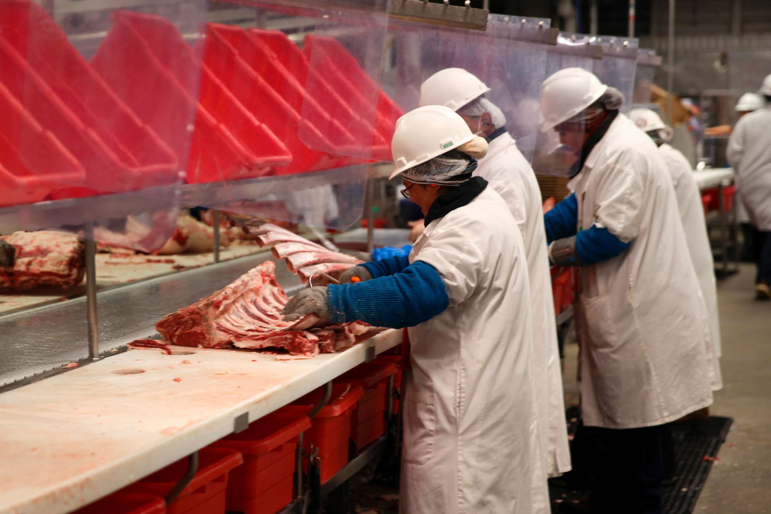 PHOTO: In this Nov. 2, 2022, file photo, workers carve up cuts of beef at the Greater Omaha Packing beef processing plant in Omaha, Neb.