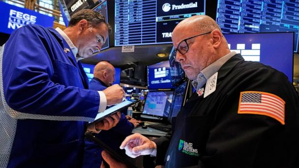 Traders work on the floor of the New York Stock Exchange, May 29, 2025.