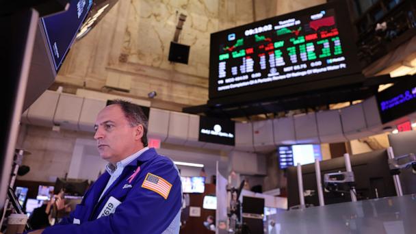 Dow closes at record high, defying fears of panic sparked by Trump's tariff threat