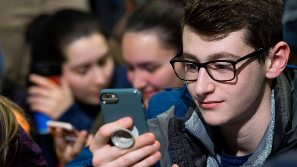 PHOTO: Students watch content livestreamed on Facebook in their phones on March 19, 2019 in Keene, N.H.