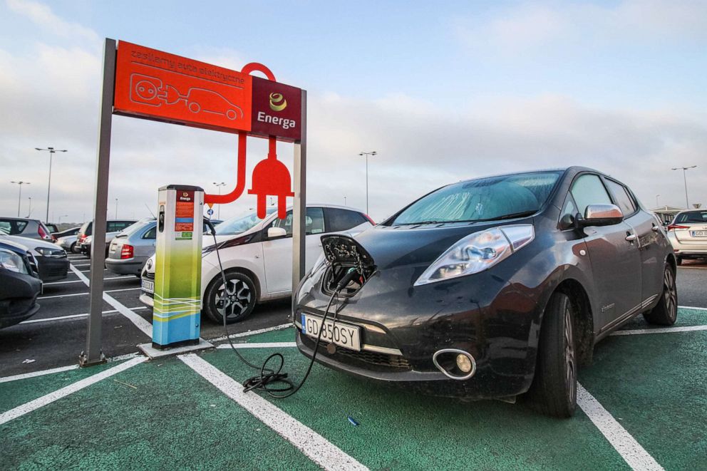 PHOTO: Nissan Leaf - a full electric plug-in vehicle or EV, is connected to an Energy company charger near the Auchan shopping mall on a dedicated to the EV's parking place in a green color is seen in Gdansk, Poland, Oct. 23, 2019.