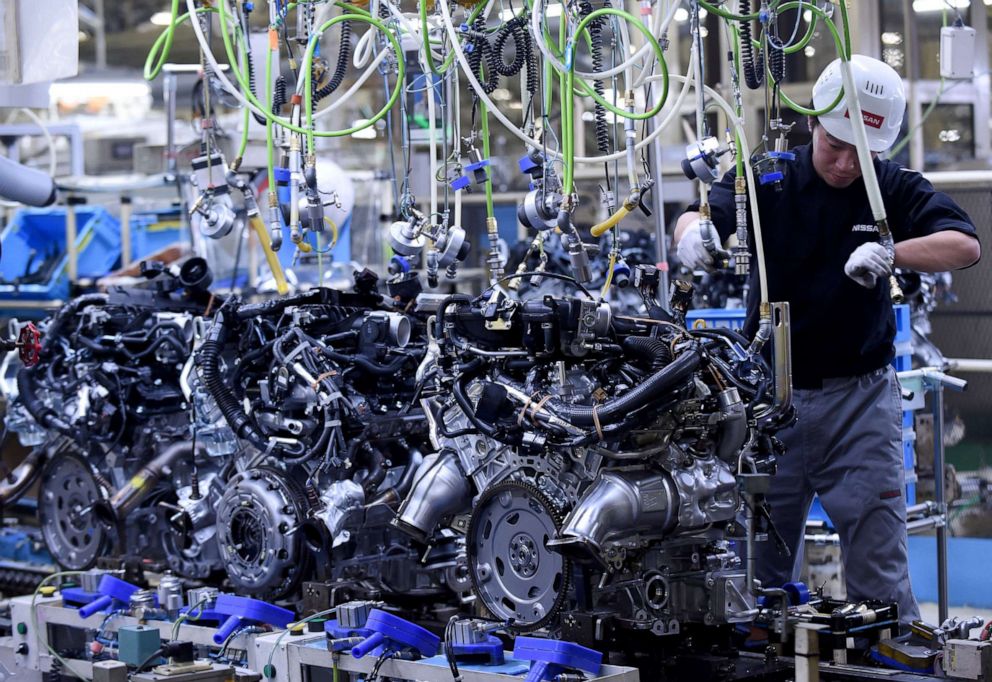 PHOTO: In this April 5, 2016, file photo, an employee works at the main assembly line of V6 engines at Iwaki Plant of Nissan Motor in Iwaki, Fukushima prefecture, Japan.