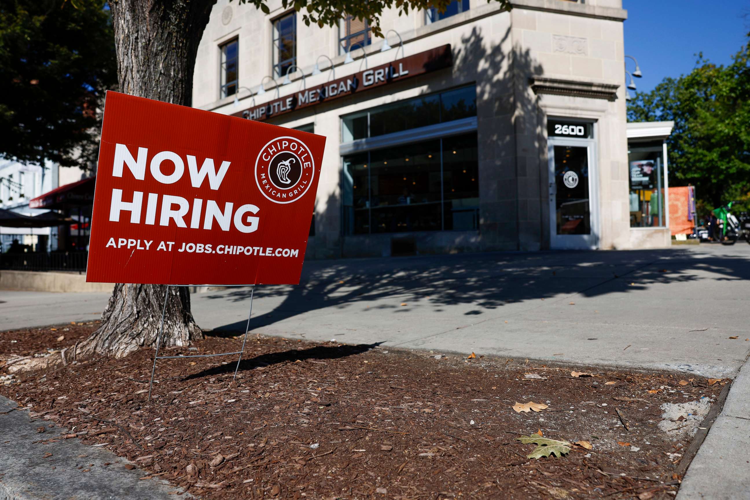 PHOTO: A "Now Hiring" sign is displayed in front of a Chipotle restaurant on Oct. 7, 2022, in Washington, D.C.