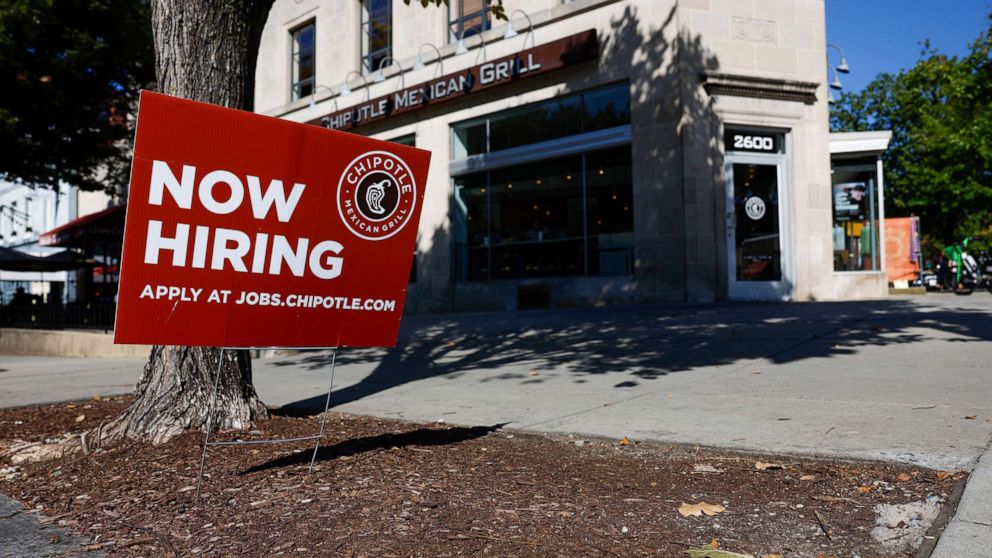PHOTO: A "Now Hiring" sign is displayed in front of a Chipotle restaurant on Oct. 7, 2022, in Washington, D.C.