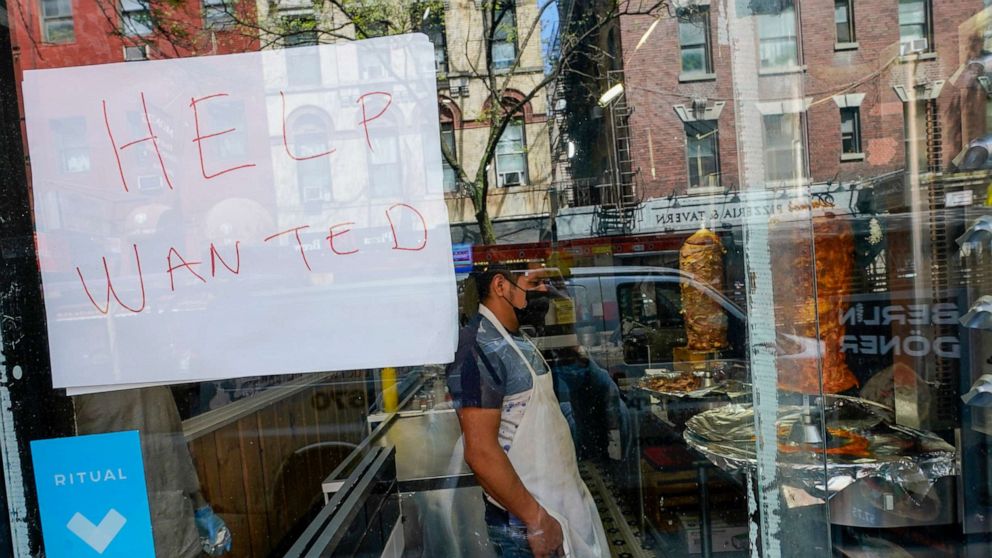 PHOTO: A Help Wanted sign hangs in the window of a restaurant in the Greenwich Village neighborhood of Manhattan in New York City, May 4, 2021.