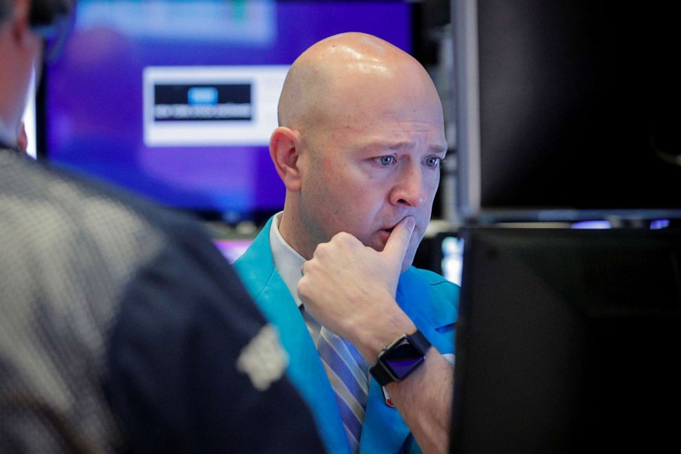 PHOTO: Traders work on the floor at the New York Stock Exchange in New York, Feb. 25, 2020.