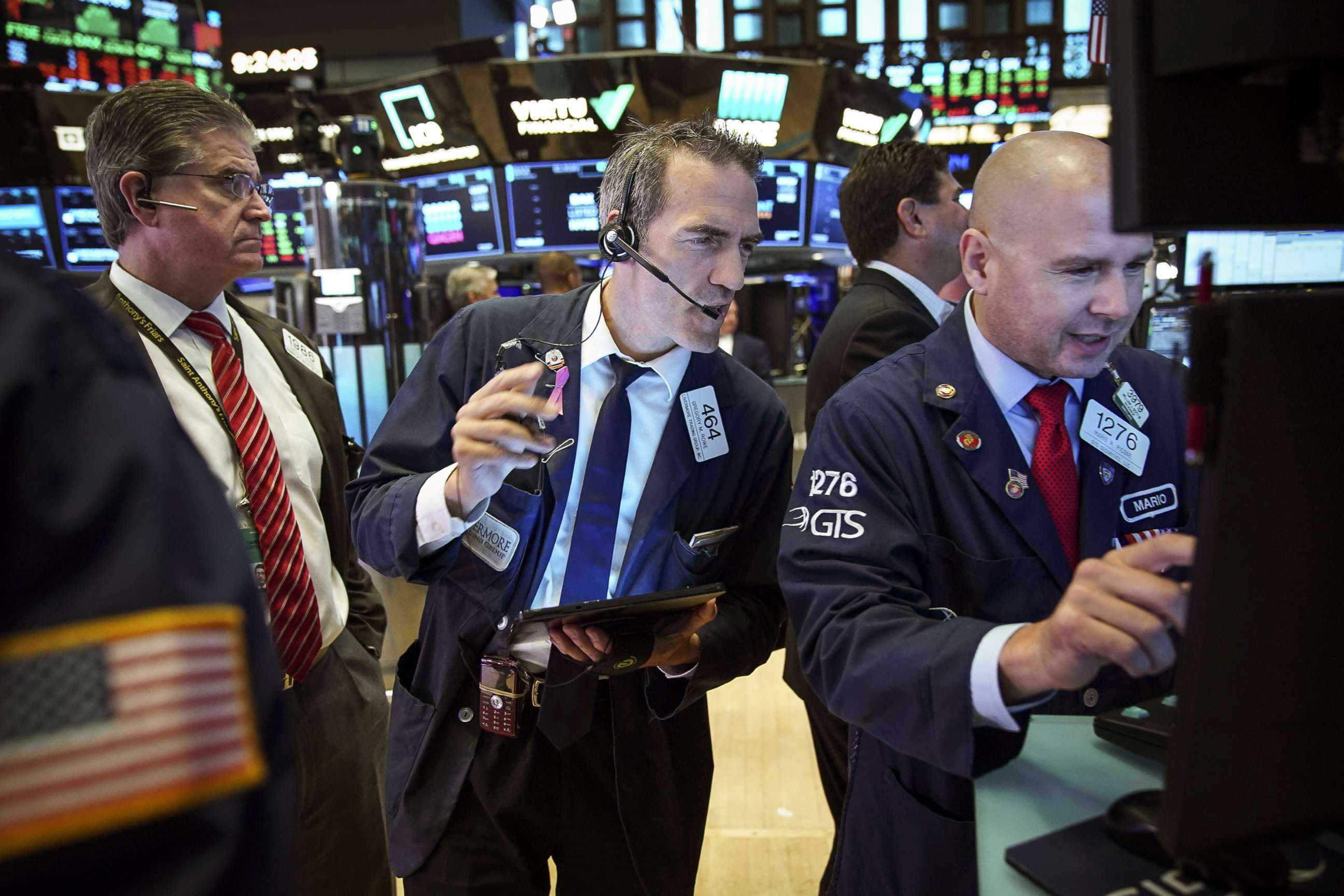 PHOTO: Traders and financial professionals work on the floor of the New York Stock Exchange (NYSE) on Aug. 6, 2019 in the Brooklyn borough of  New York City.