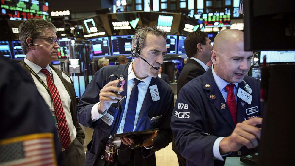PHOTO: Traders and financial professionals work on the floor of the New York Stock Exchange (NYSE) on Aug. 6, 2019 in the Brooklyn borough of  New York City.