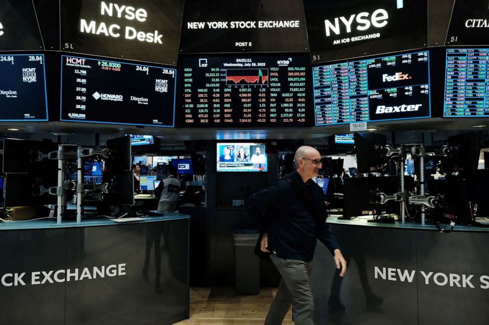 PHOTO: Traders work on the floor of the New York Stock Exchange (NYSE) on July 26, 2023 in New York.