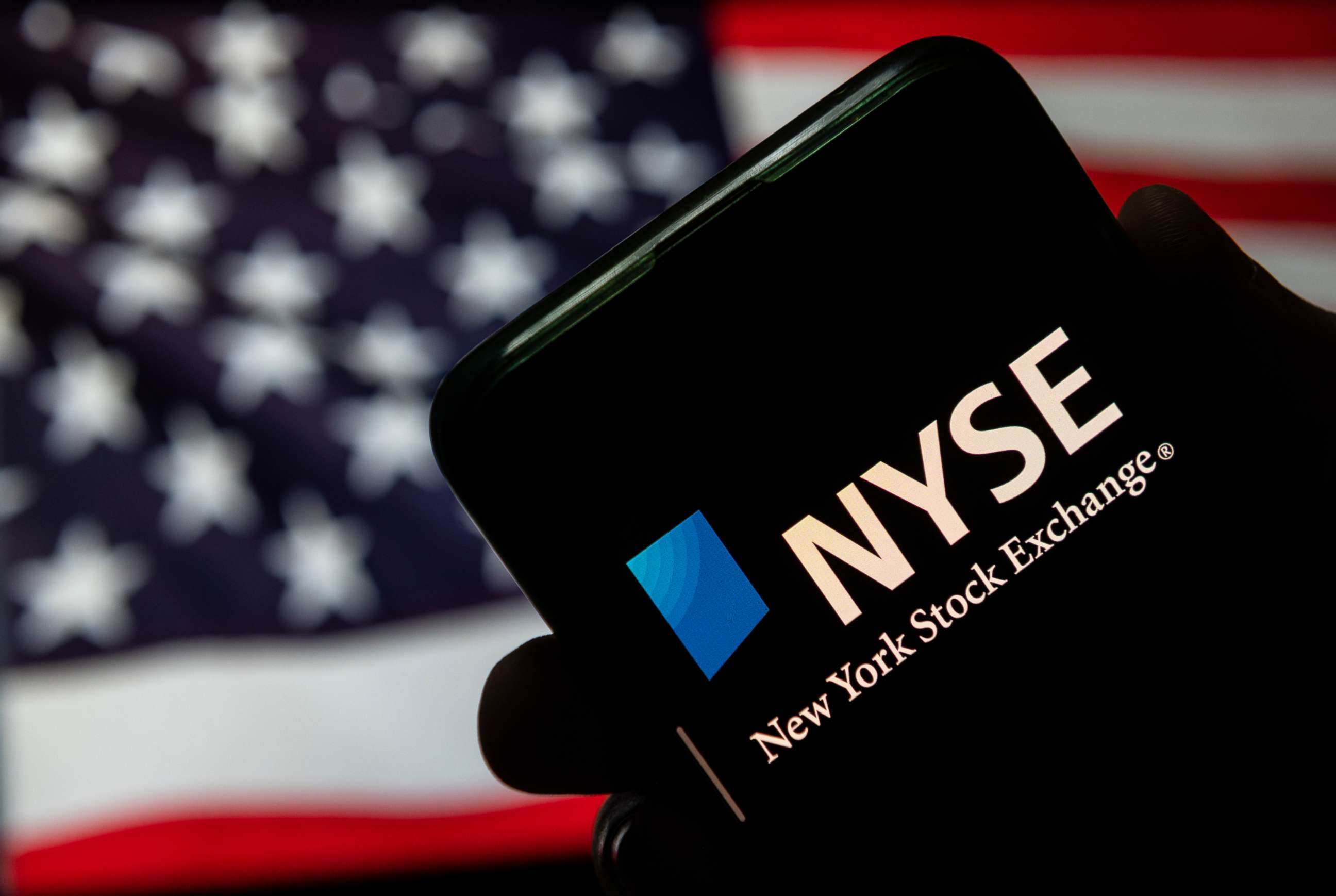 PHOTO: New York Stock Exchange logo is seen on a mobile device.